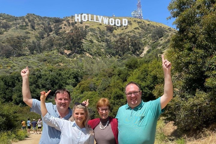 Family of four at the Hollywood Sign viewpoint in Los Angeles