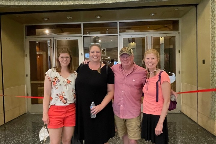 Four people standing in front of the Dolby Theatre entrance.