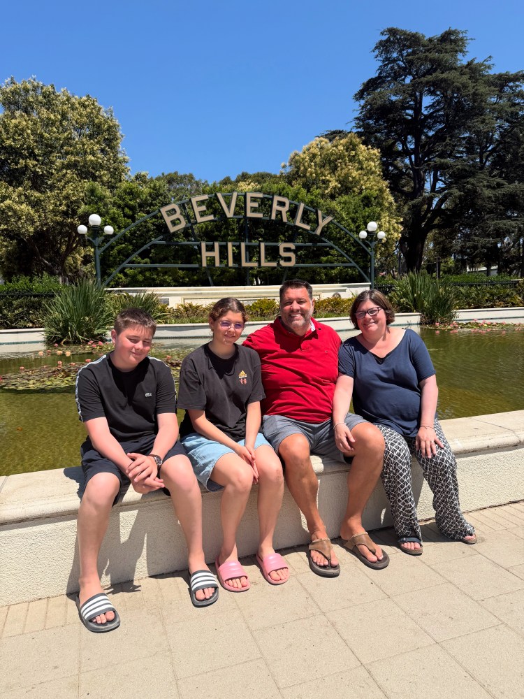 Family enjoying a private Los Angeles tour at the Beverly Hills sign