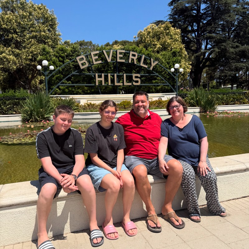 Family enjoying a private Los Angeles tour at the Beverly Hills sign