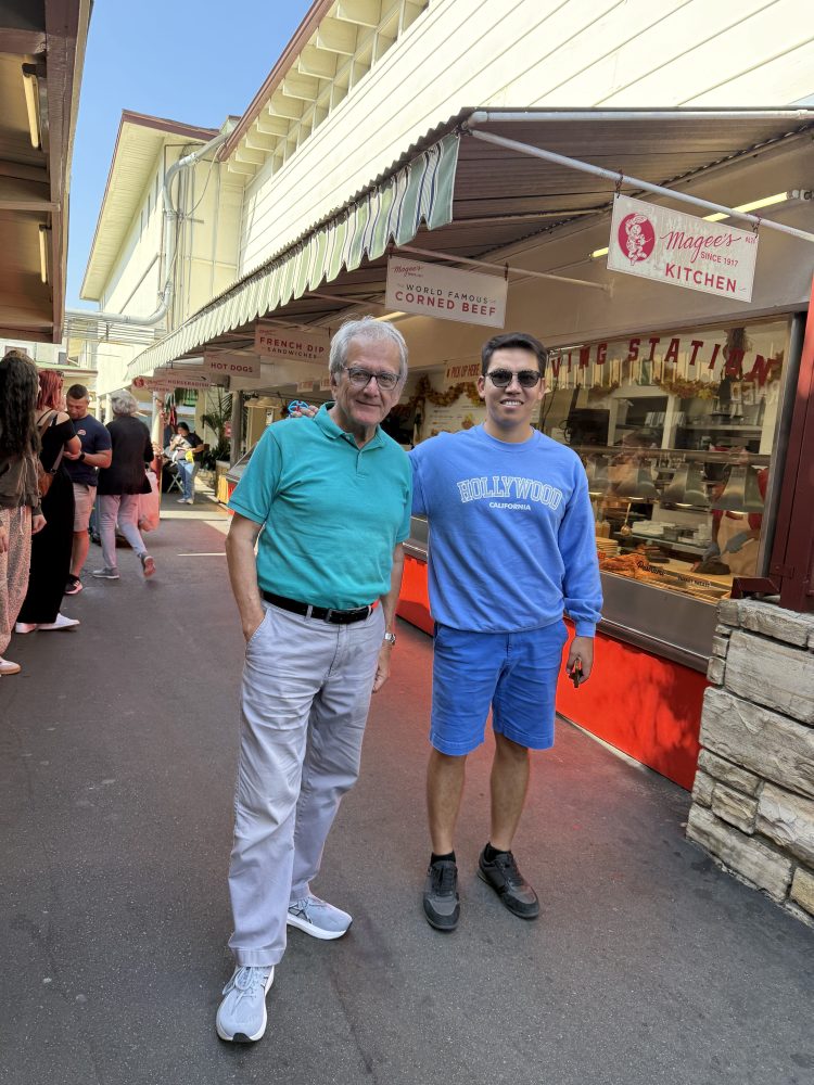 Two guests on a Guideline Tours private Los Angeles tour standing at the historic Original Farmers Market in Los Angeles.