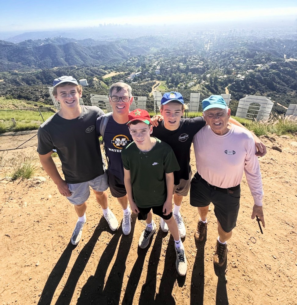 Ray celebrating his eightieth birthday with his son and grandsons on the Hollywood Sign hiking trail with guide Dave, with the Los Angeles basin visible in the background