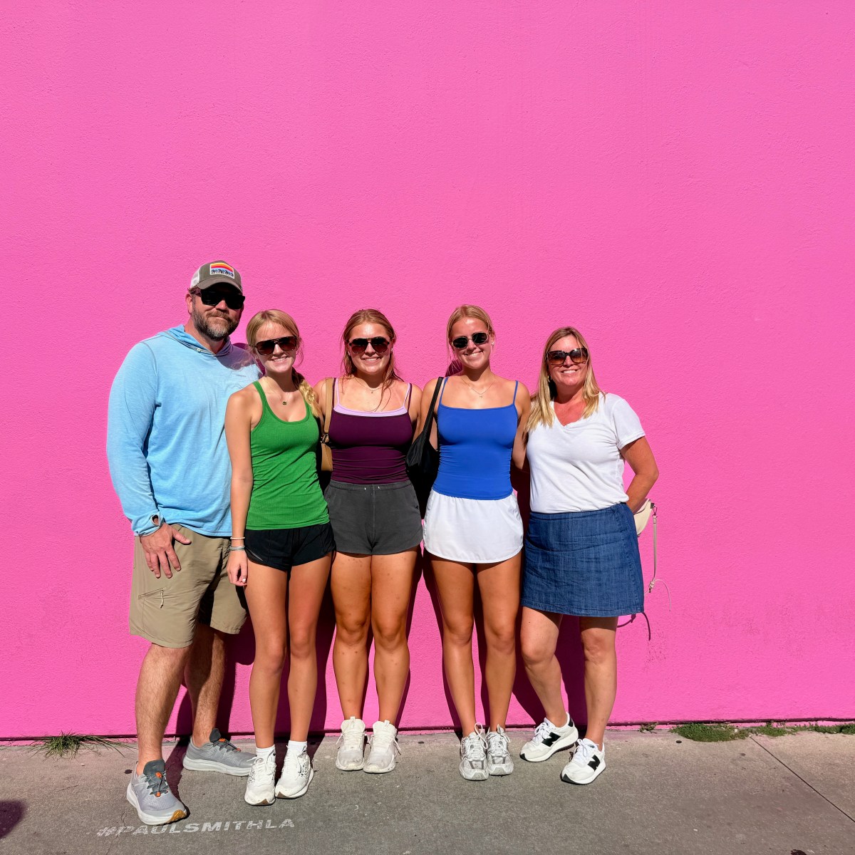 Family of five from St. Louis on a Guideline Tours private tour at the Paul Smith pink wall on Melrose Avenue