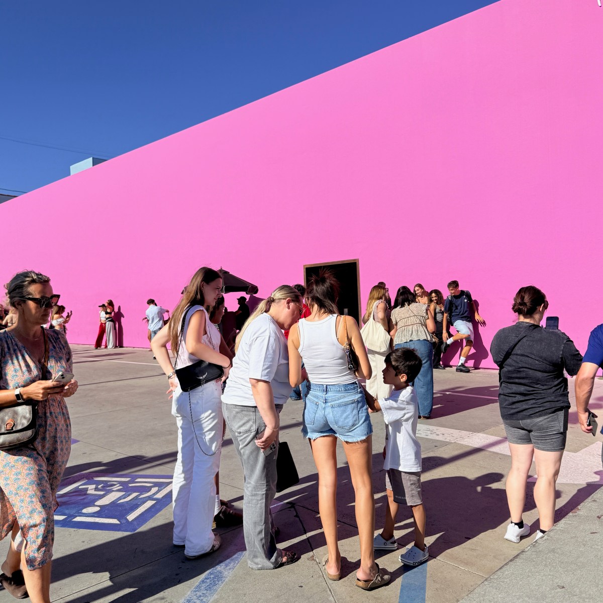 Crowds photographing the Paul Smith pink wall on Melrose Avenue in Los Angeles